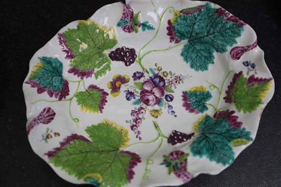 A pair of Chelsea botanical vine leaf dishes, c.1755 and a a pair of similar Bow dishes, c.1758, W. 21.5cm and 26cm, one Bow dish repai